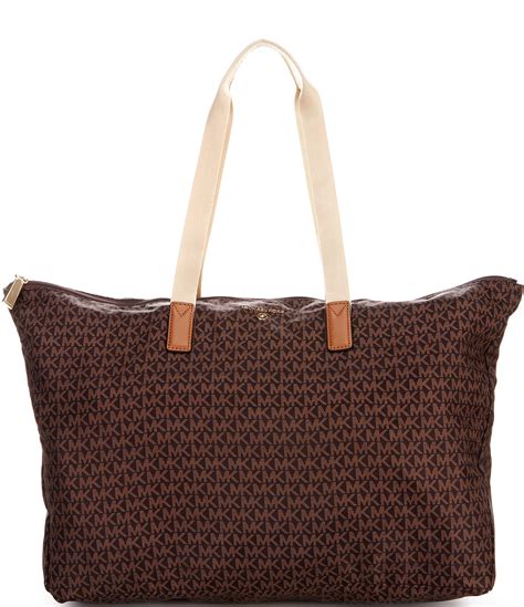 michael michael kors jet set travel extra large multi-function tote|Michael Kors bag with airplanes.